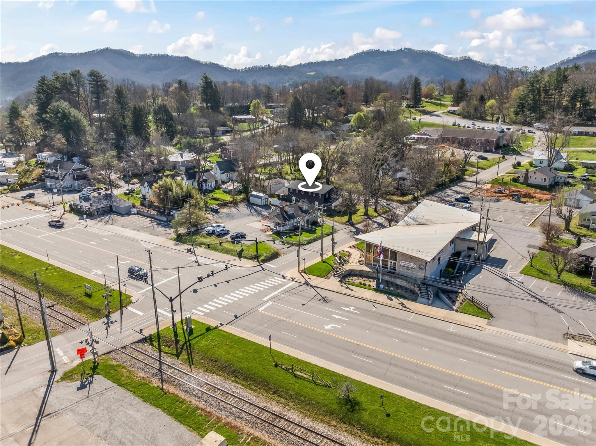71 Maple Street Clyde, NC 28721 - Photo 20 of 22 an aerial view of a house with a mountain