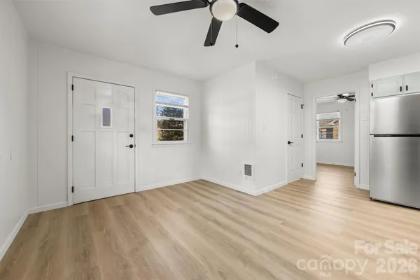 a kitchen with stainless steel appliances granite countertop a stove and a refrigerator