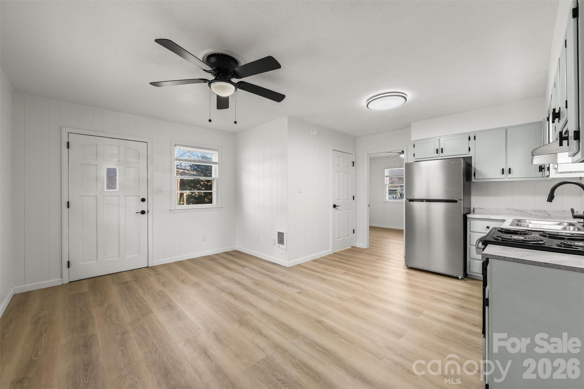 71 Maple Street Clyde, NC 28721 - Photo 7 of 22 a view of a kitchen with a sink and stainless steel appliances
