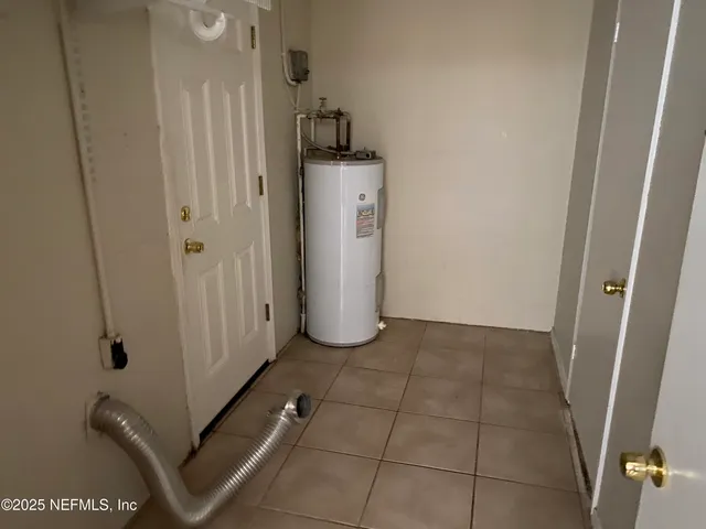 a view of a storage & utility room with a sink