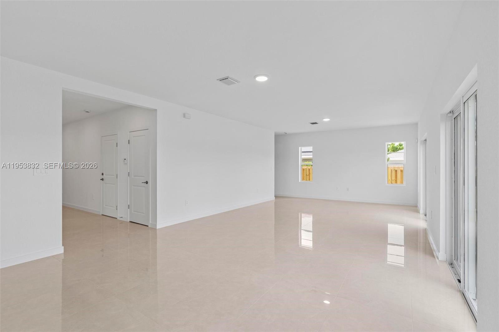 27364 Southwest 133rd Path Homestead, FL 33032 - Photo 12 of 40 a view of a big room with windows and table