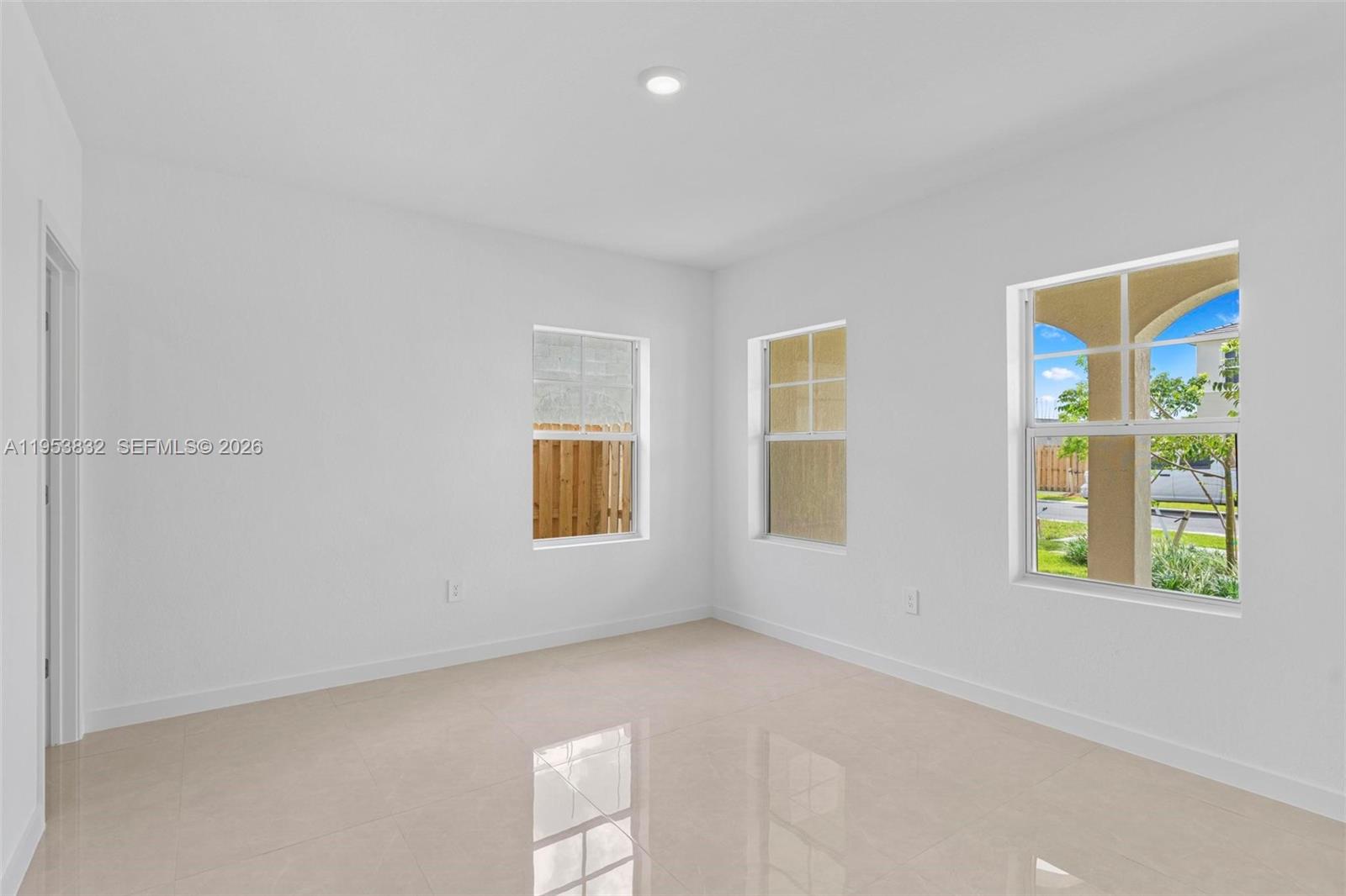 27364 Southwest 133rd Path Homestead, FL 33032 - Photo 16 of 40 a view of an empty room with a window