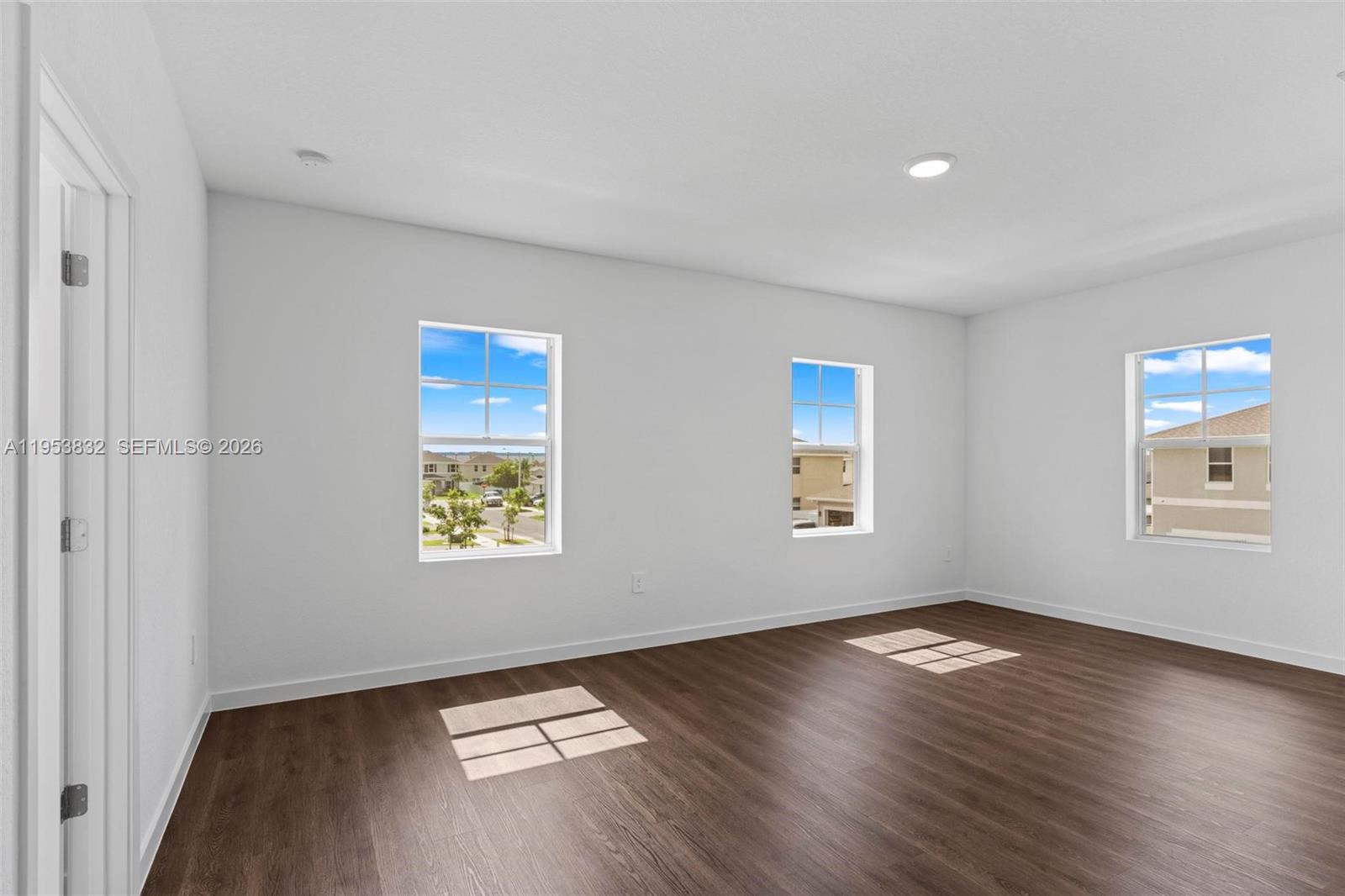 27364 Southwest 133rd Path Homestead, FL 33032 - Photo 22 of 40 a view of room with window and wooden floor