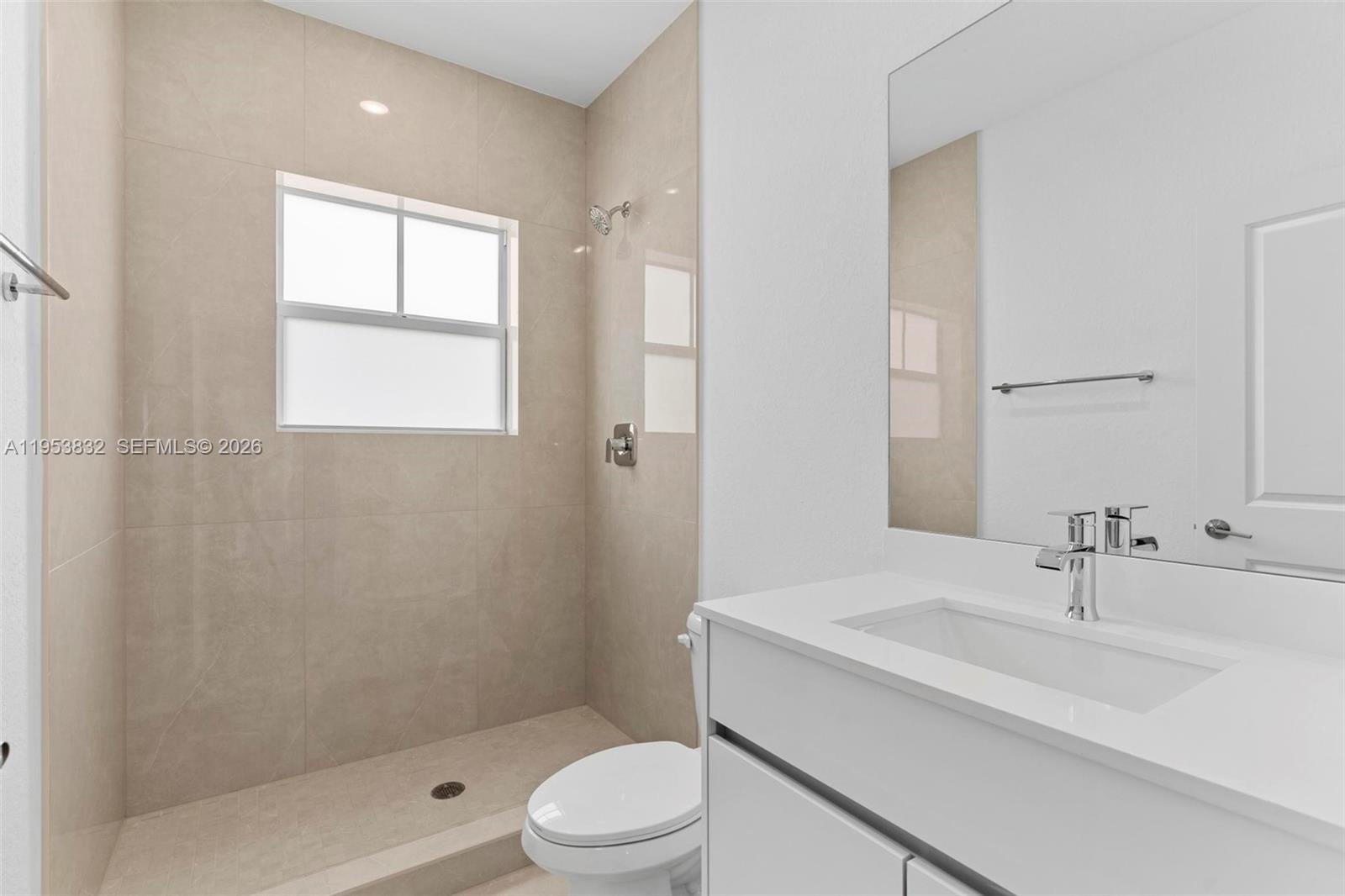 27364 Southwest 133rd Path Homestead, FL 33032 - Photo 29 of 40 a bathroom with a sink a toilet and shower