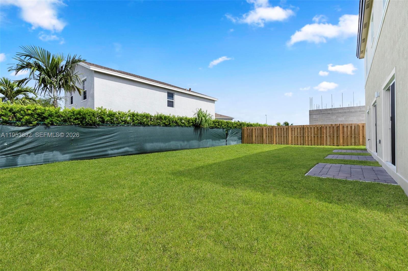 27364 Southwest 133rd Path Homestead, FL 33032 - Photo 35 of 40 a front view of a house with garden