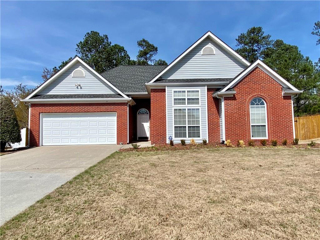 2148 Raccoon Court Villa Rica, GA 30180 - Photo 1 of 1 a front view of a house with a yard and garage