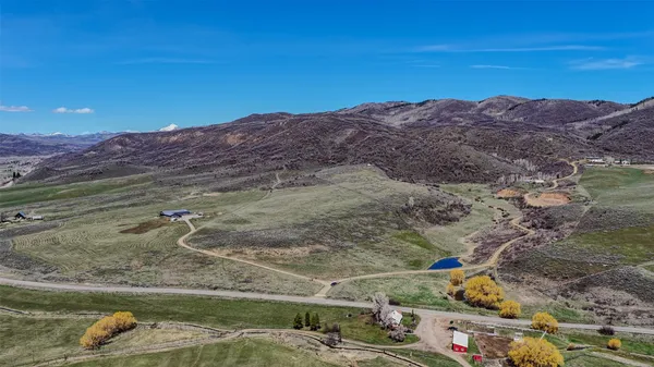 a view of a backyard with mountain view