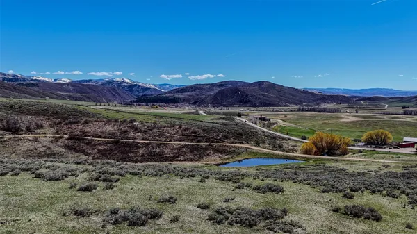 a view of a mountain with sunset view