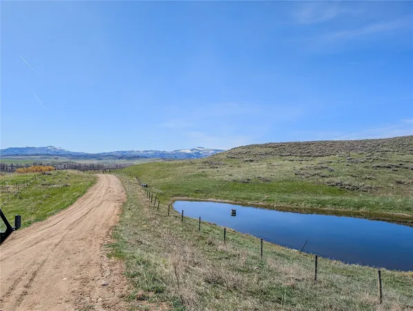 a view of an ocean beach and mountain