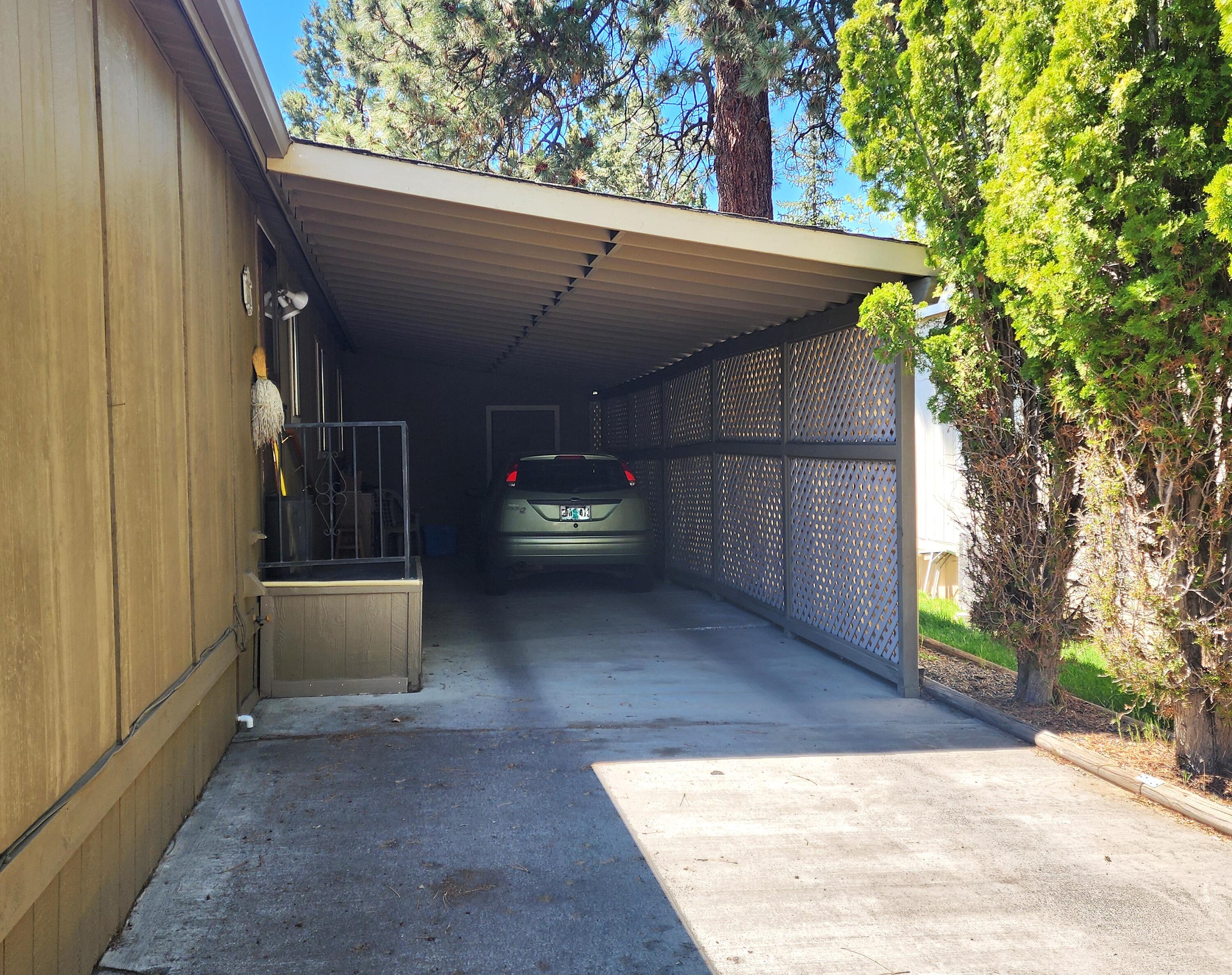 1001 Southeast 15th Street, Unit 34 Bend, OR 97702 - Photo 36 of 43 Concrete driveway and deep carport