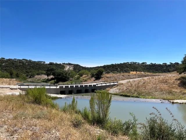 a view of lake with green space