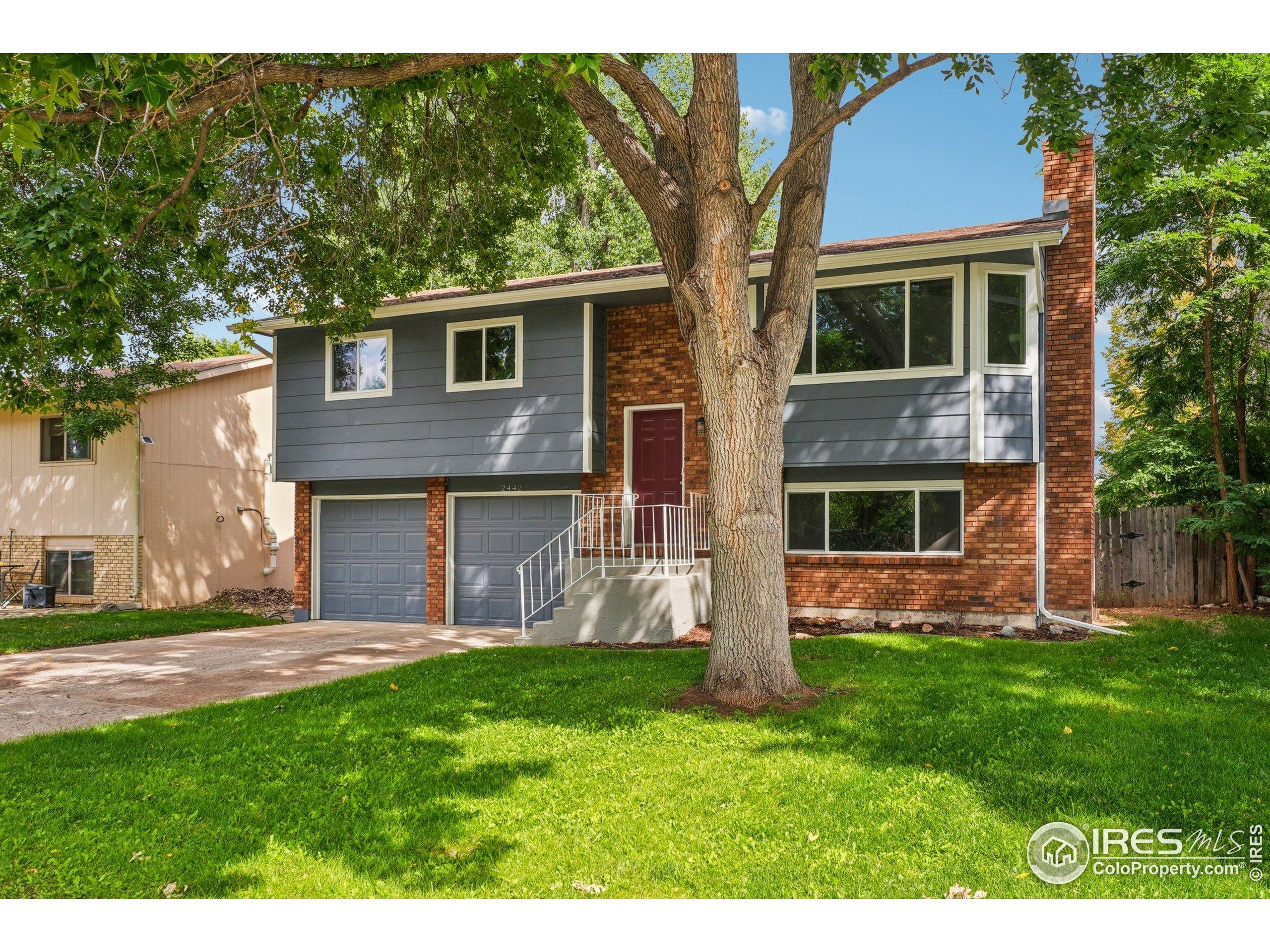 2442 Amherst Street Fort Collins, CO 80525 - Photo 2 of 49 a house view with a garden space