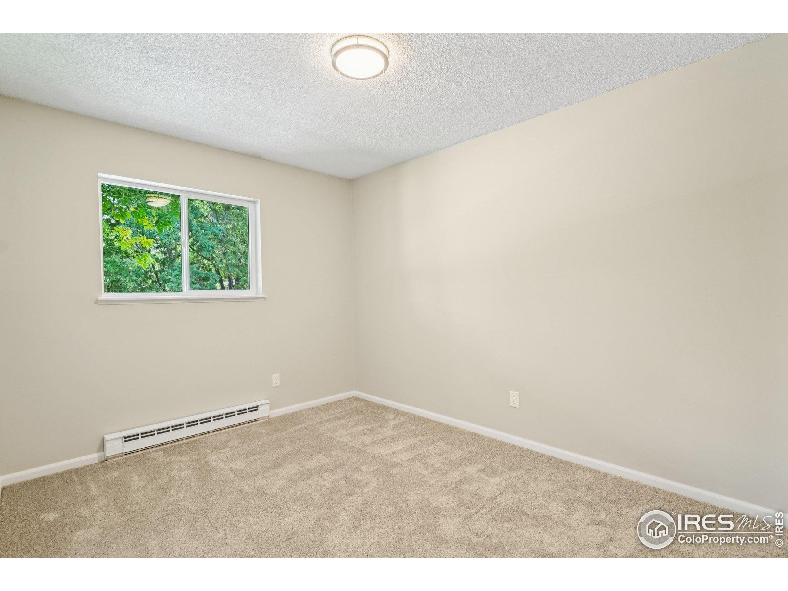 2442 Amherst Street Fort Collins, CO 80525 - Photo 23 of 49 an empty room with a window