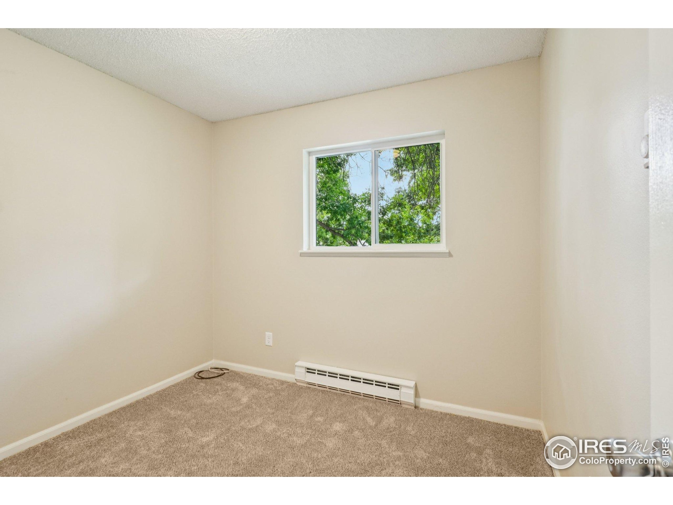 2442 Amherst Street Fort Collins, CO 80525 - Photo 26 of 49 an empty room with windows