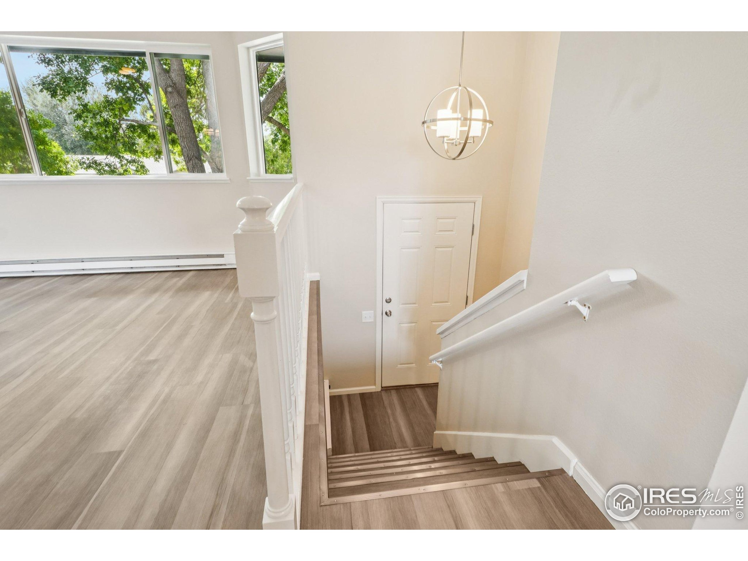 2442 Amherst Street Fort Collins, CO 80525 - Photo 28 of 49 a view of an entryway with wooden floor