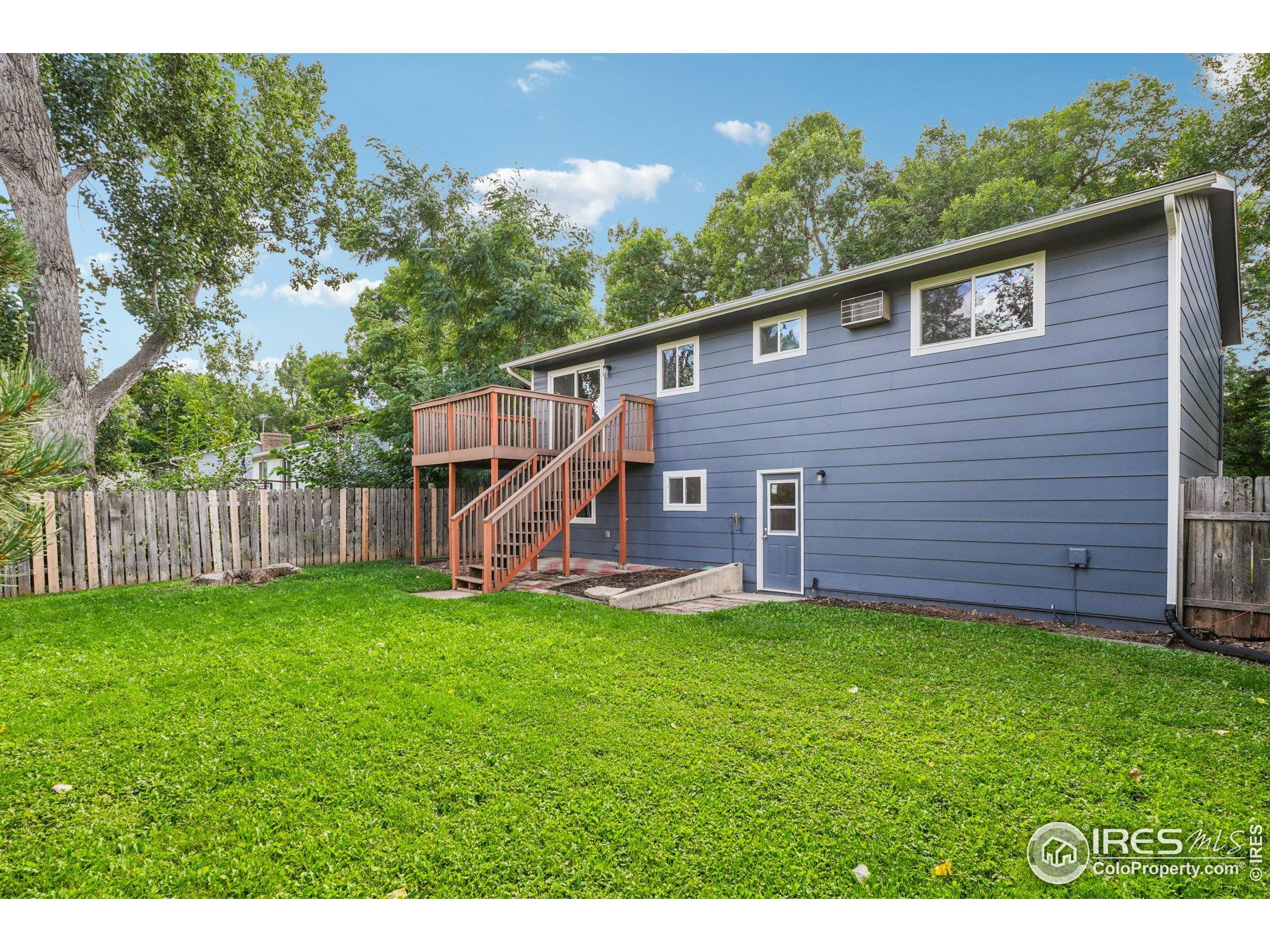 2442 Amherst Street Fort Collins, CO 80525 - Photo 44 of 49 a view of a backyard with a garden