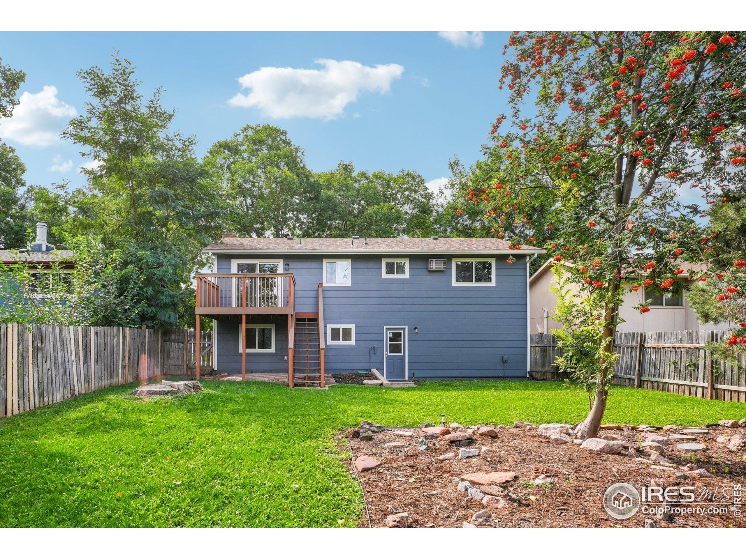 2442 Amherst Street Fort Collins, CO 80525 - Photo 45 of 49 a view of a house with a yard