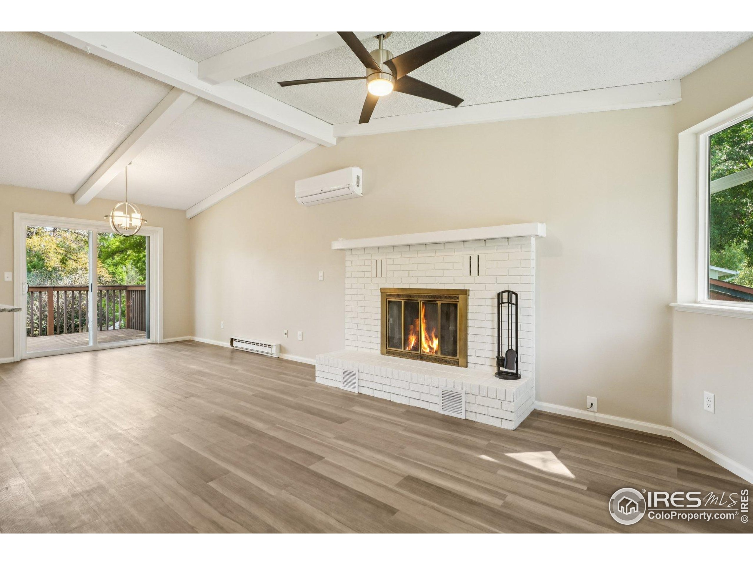 2442 Amherst Street Fort Collins, CO 80525 - Photo 9 of 49 an empty room with windows and fireplace