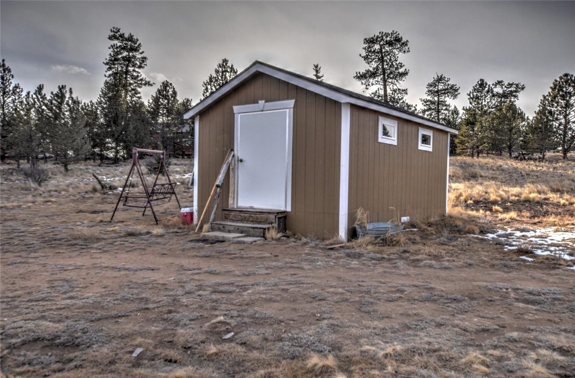 810 Buffalo Ridge Road Como, CO 80432 - Photo 26 of 31 a view of a house with a yard