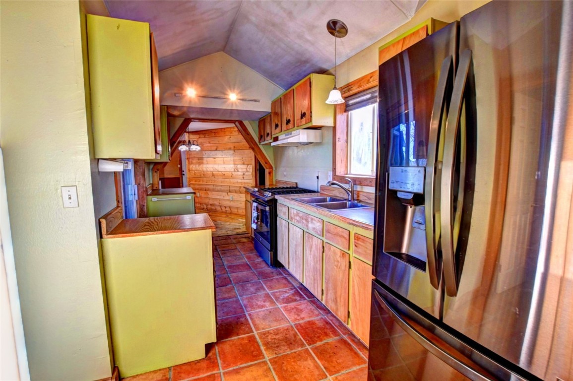 810 Buffalo Ridge Road Como, CO 80432 - Photo 9 of 31 a kitchen with sink a refrigerator and wooden floor