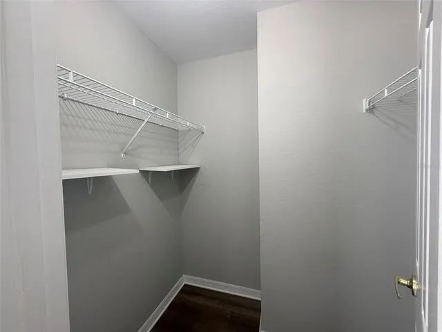 a view of an empty walk in closet