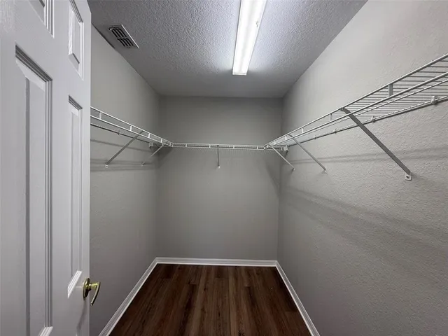 a view of a room with racks on the wall