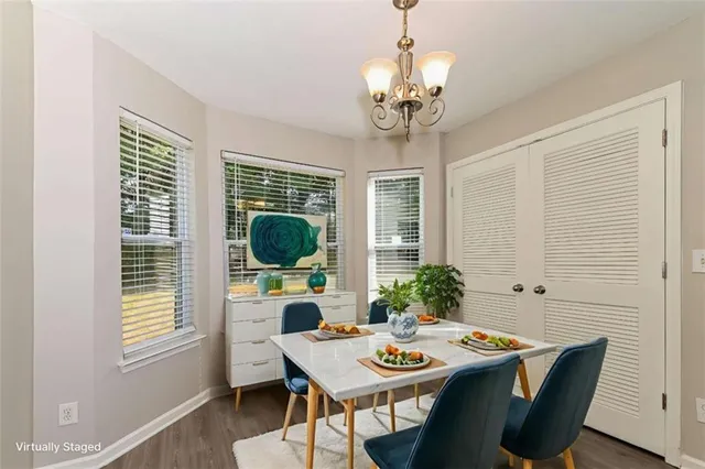 a view of a dining room with furniture window and wooden floor