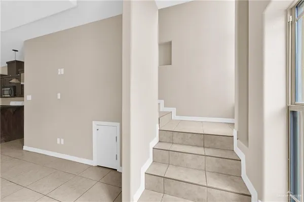 a view of bathroom with bathtub and closet