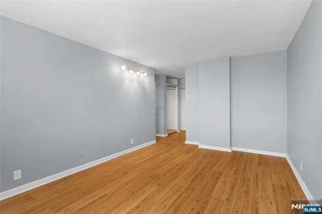 a view of room with wooden floor