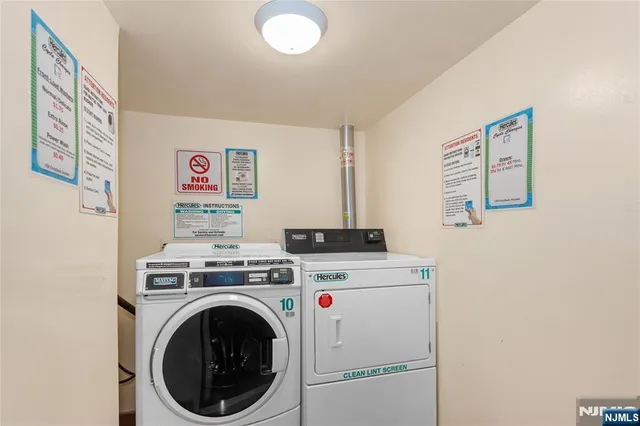 a view of a storage & utility room with washer and dryer