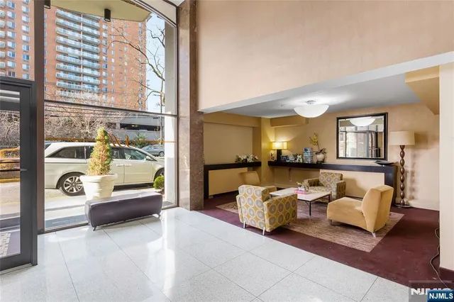 a living room with furniture and a large window
