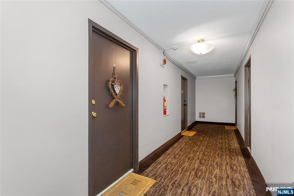 150 Overlook Avenue, Unit 6E Hackensack, NJ 07601 - Photo 5 of 30 a view of hallway with wooden floor