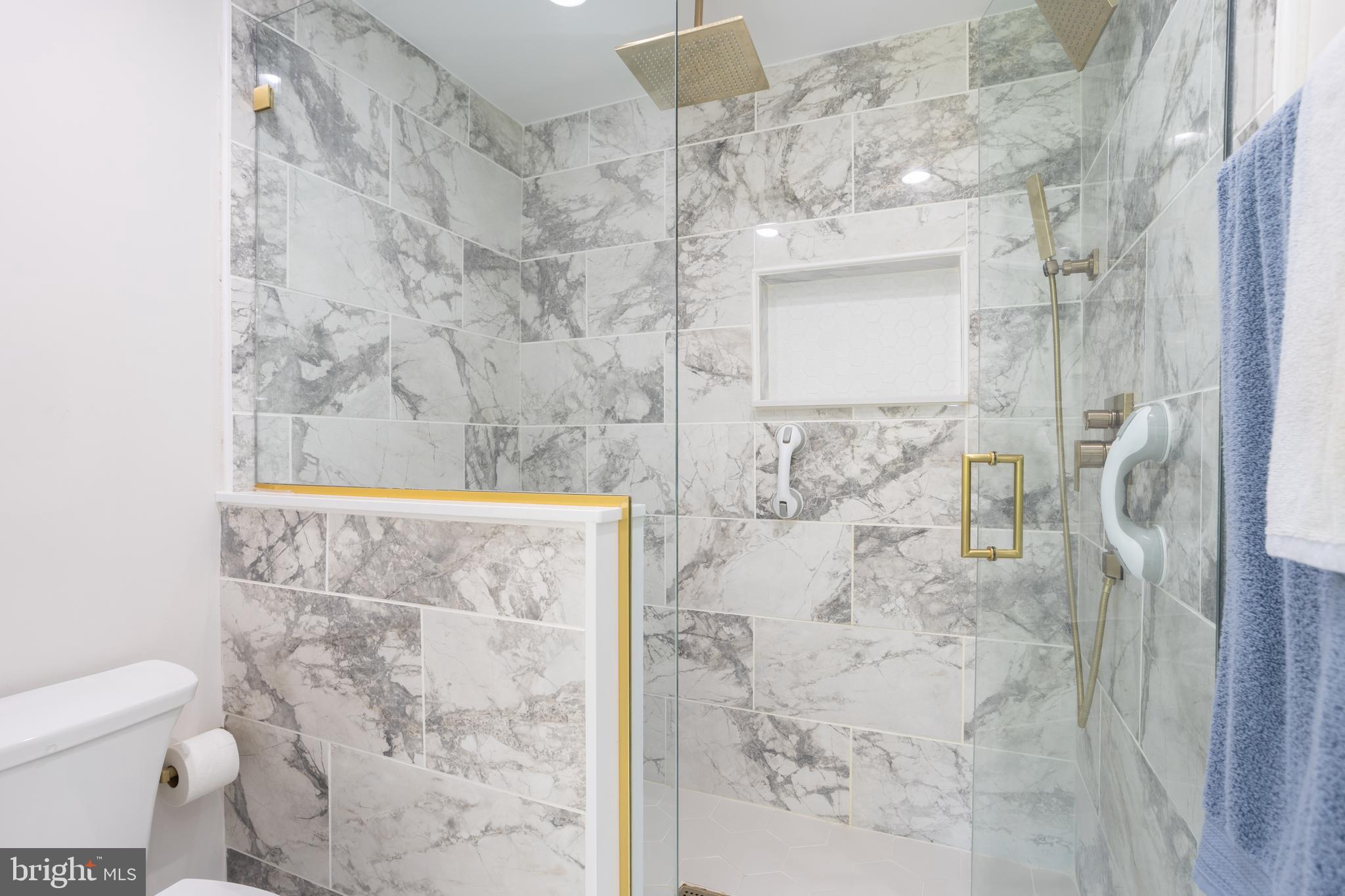 13829 Manor Glen Road Baldwin, MD 21013 - Photo 48 of 82 a bathroom with a shower and a toilet