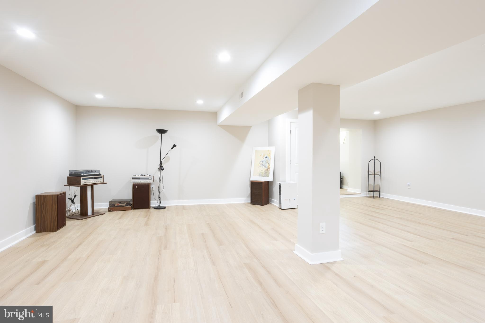 13829 Manor Glen Road Baldwin, MD 21013 - Photo 66 of 82 a view of an empty room with wooden floor