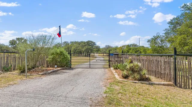 a view of a bench in front of a house