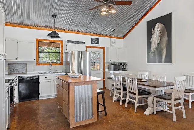 a kitchen that has a lot of cabinets in it