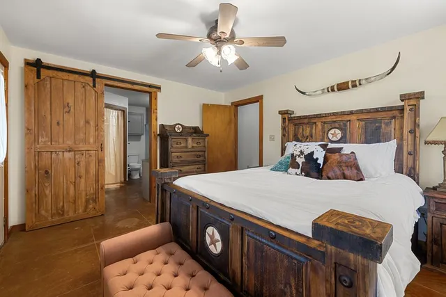 a bed room with a bed and a chandelier