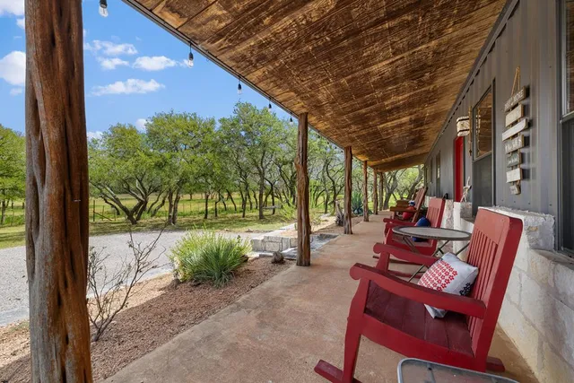 a outdoor space with patio the couches and pool table with chairs