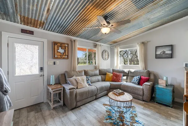 a living room with furniture and a window
