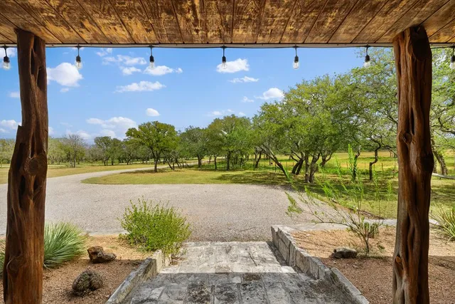 a view of a lake with a yard