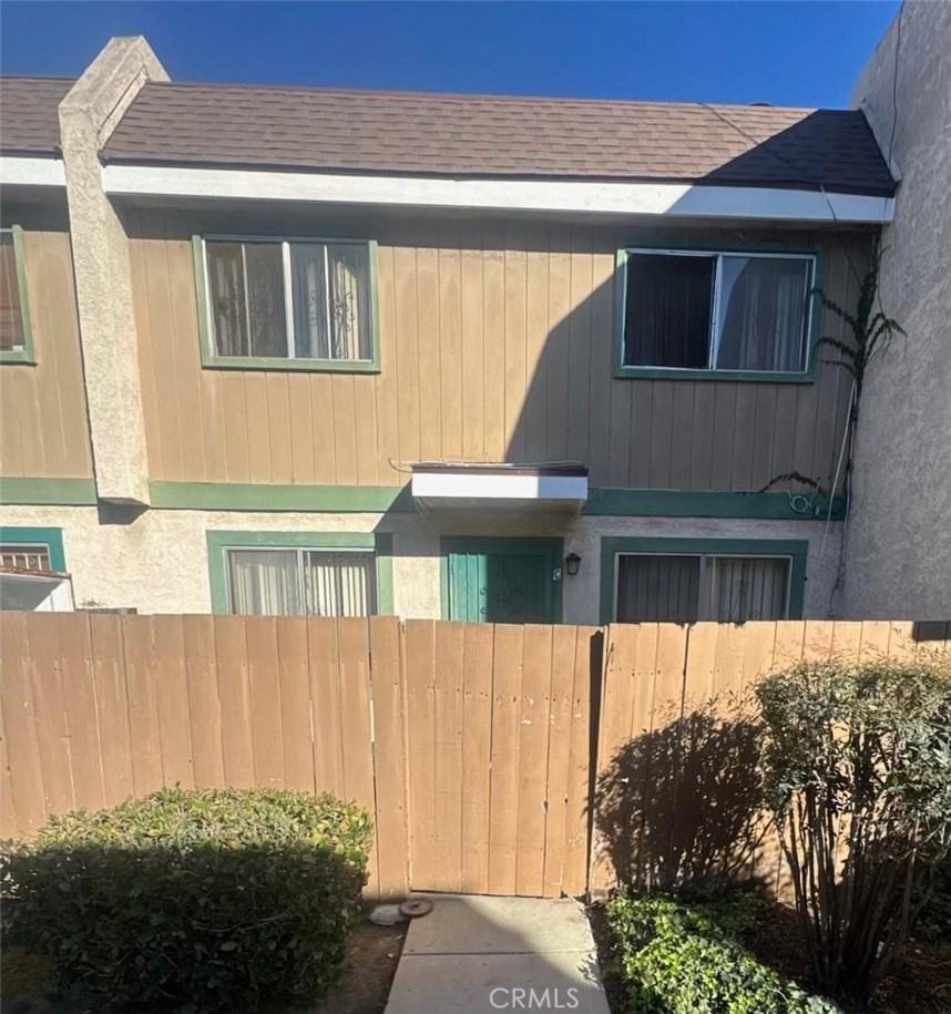 155 South Wilmington Avenue, Unit C Compton, CA 90220 - Photo 1 of 26 a view of a house with a small yard
