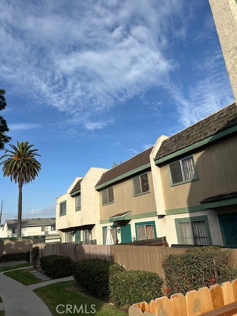 155 South Wilmington Avenue, Unit C Compton, CA 90220 - Photo 11 of 26 a front view of a house with a yard