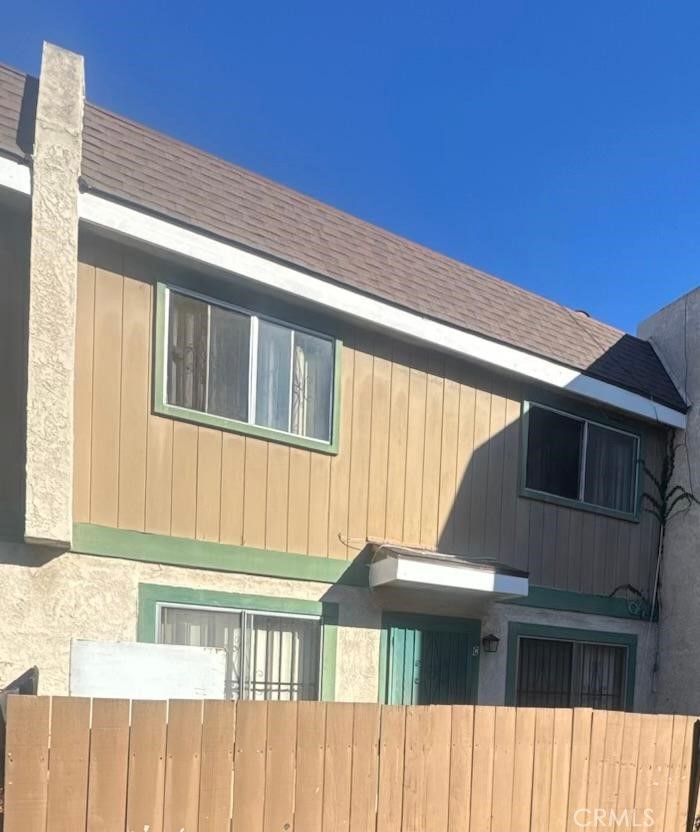 155 South Wilmington Avenue, Unit C Compton, CA 90220 - Photo 2 of 26 a front view of a house with a balcony