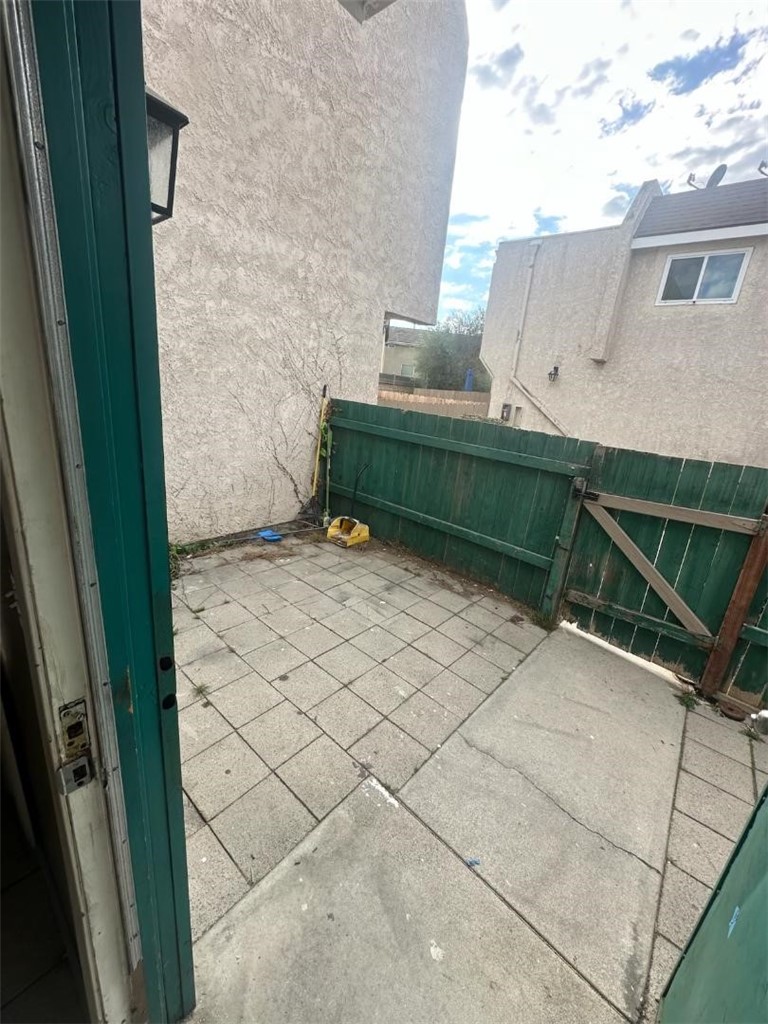 155 South Wilmington Avenue, Unit C Compton, CA 90220 - Photo 25 of 26 a view of backyard with barbeque grill and wooden tub