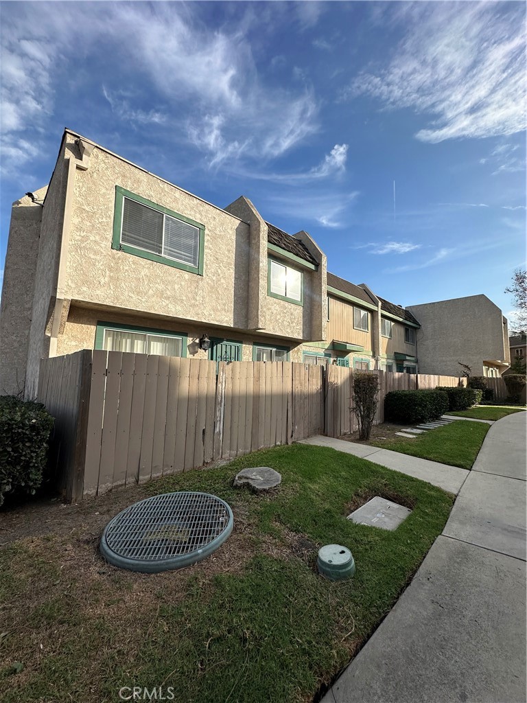 155 South Wilmington Avenue, Unit C Compton, CA 90220 - Photo 5 of 26 a front view of a house with garden