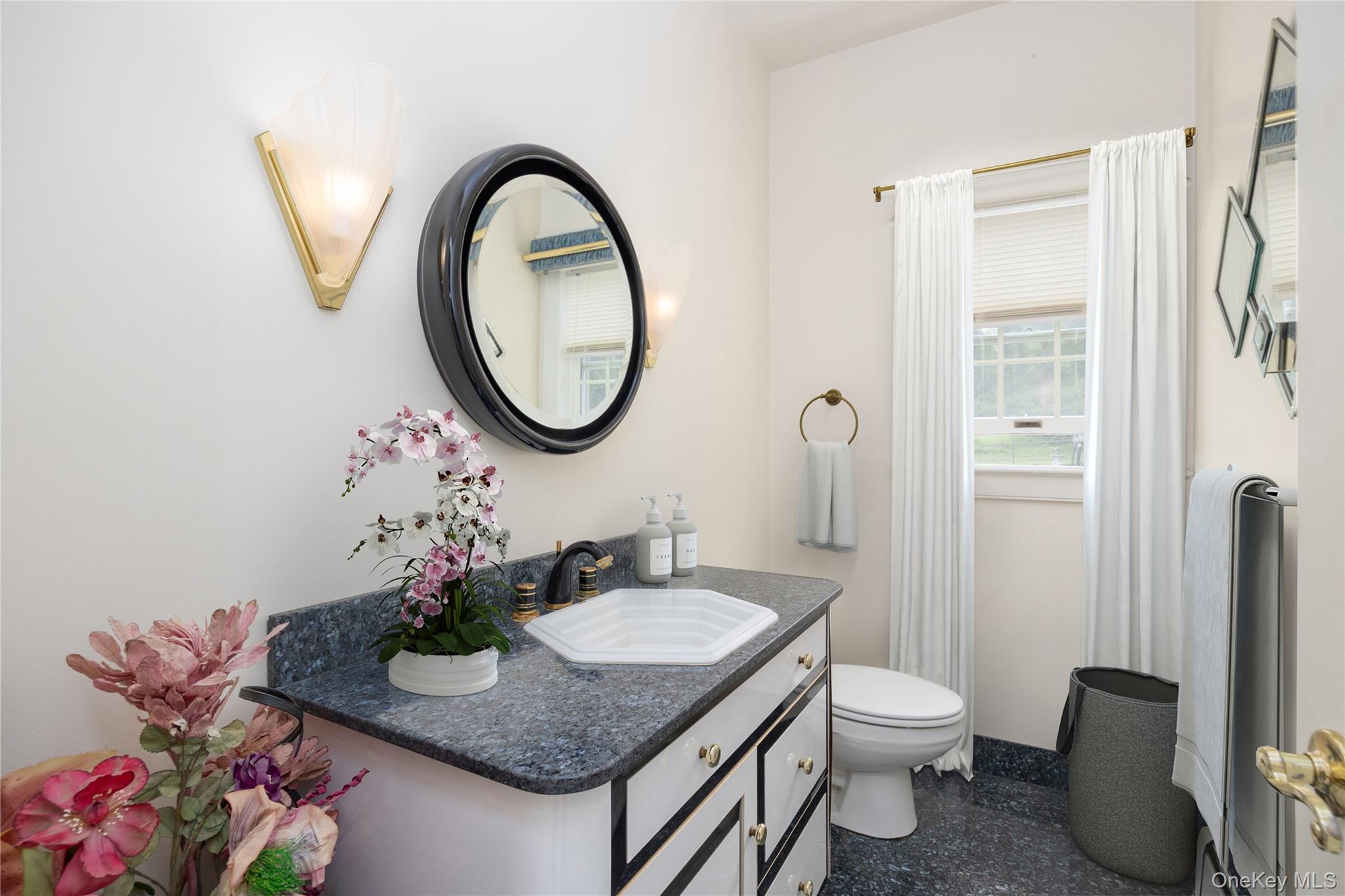 219 Maple Avenue Monroe, NY 10950 - Photo 11 of 40 a bathroom with a granite countertop sink and a mirror