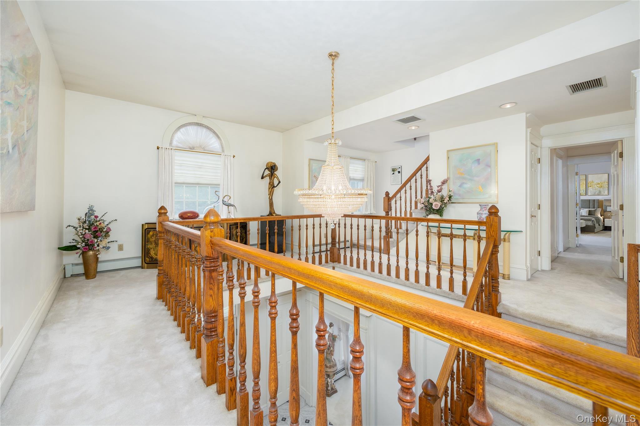 219 Maple Avenue Monroe, NY 10950 - Photo 12 of 40 a view of staircase with railing and a chandelier