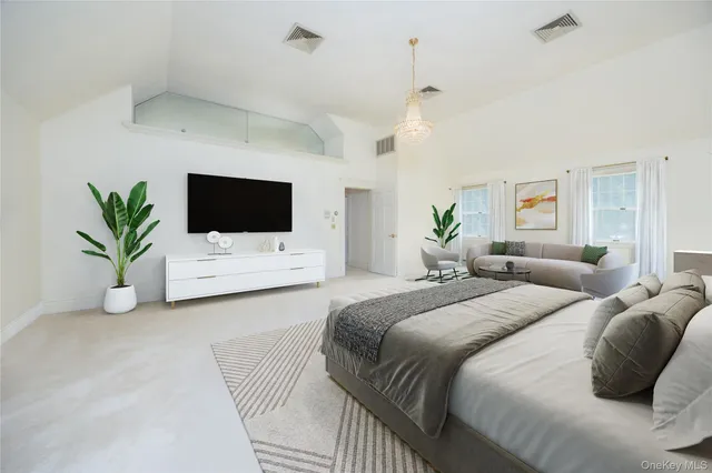 a spacious bathroom with a tub sink and mirror