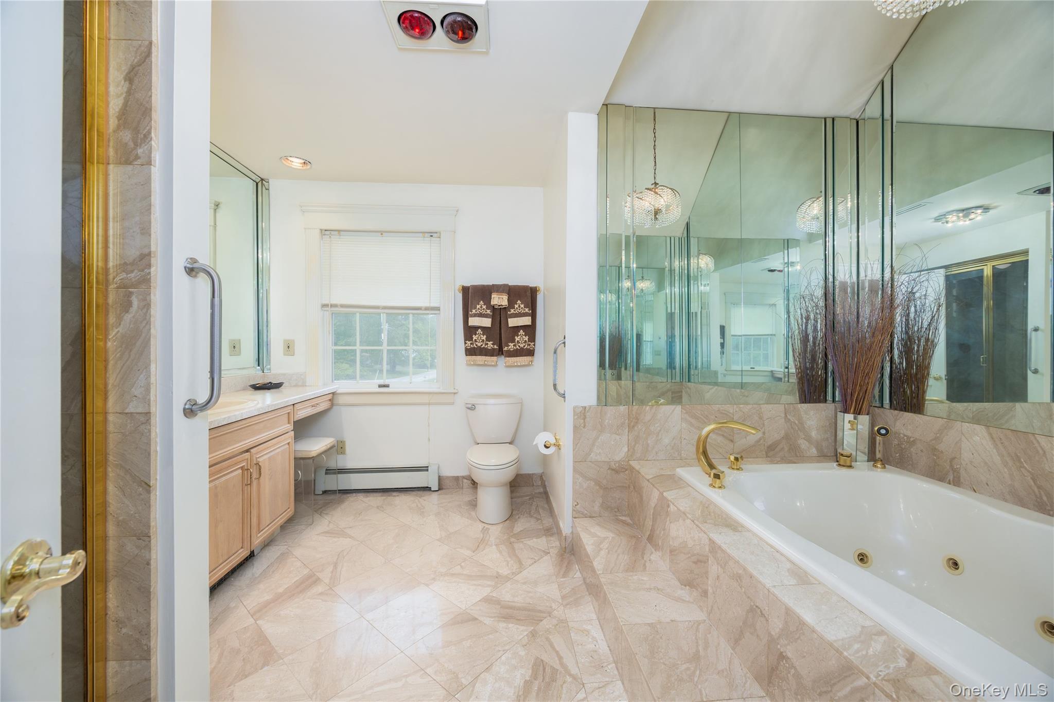 219 Maple Avenue Monroe, NY 10950 - Photo 16 of 40 a spacious bathroom with a tub sink and mirror