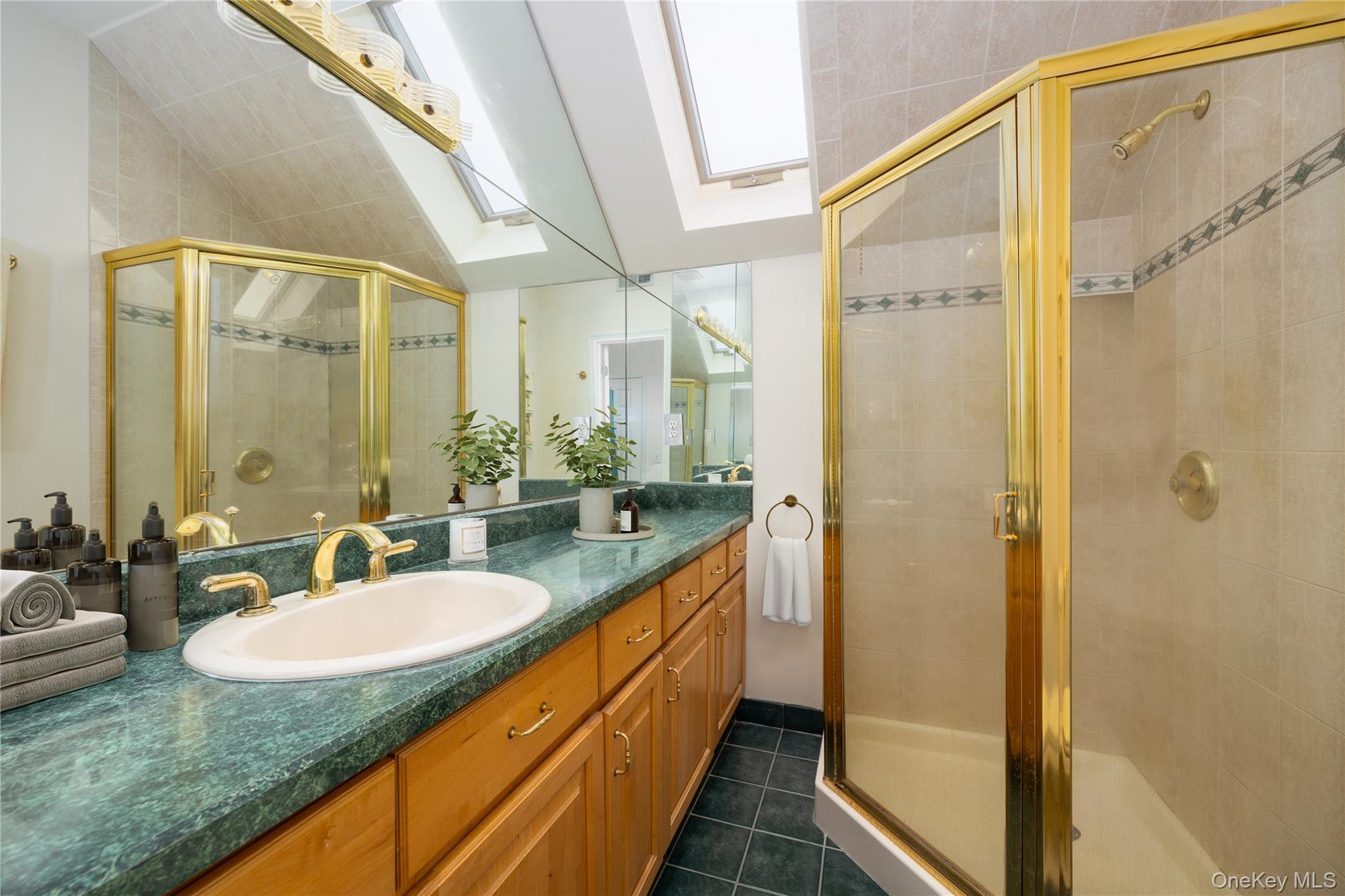 219 Maple Avenue Monroe, NY 10950 - Photo 23 of 40 a bathroom with a granite countertop sink and a mirror